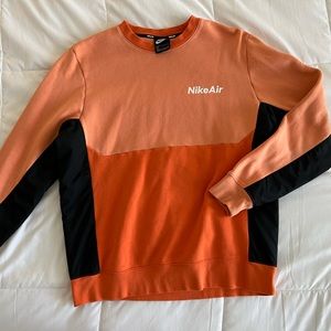 Nike Orange Crewneck Sweater with Bold Color-Block Design